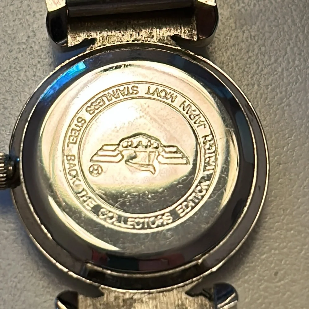 Two vintage quartz watches one stainless steel with hearts one with blue trim